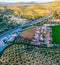 Riofrio village in Andalusia Spain near Granada. Loja district. Olive fields. Aerial. Sunset