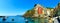Riomaggiore village panorama, rocks, boats and sea. Cinque Terre, Ligury, Italy