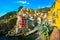 Riomaggiore village, rocks and sea at sunset. Cinque Terre, Ligu