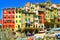 Riomaggiore village street, boats and houses. Cinque Terre, Ligury, Italy