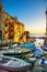 Riomaggiore village street, boats and sea. Cinque Terre, Ligury, Italy.