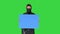 Riot policeman holding a blank board on a Green Screen, Chroma Key.