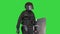 Riot policeman walking with a shield and a rubber baton on a Green Screen, Chroma Key.