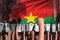 riot stopping concept - protest in Burkina Faso on flag background, police officers stand against the angry crowd - military 3D