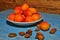 Ripe apricots in a bowl with stones
