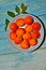 Ripe apricots in a bowl with stones