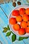 Ripe apricots in a bowl with stones