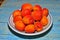 Ripe apricots in a bowl with stones