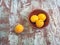 Ripe apricots in a ceramic high bowl view from above