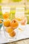 Ripe apricots in glass against background of drinks