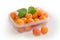 Ripe apricots in plastic food container on the light surface