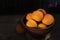 Ripe apricots in wooden bowl. Orange apricots fruits in bowl. Juicy apricots nutrition