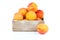 Ripe apricots in wooden box