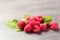 Ripe aromatic raspberries on table closeup