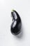 Ripe aubergine or eggplant on white background side view