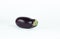 Ripe aubergine isolated on a white background .