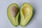 Ripe avacado on a white background. Bad cholesterol prevention food