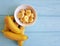 Ripe banana plate snack piece on a blue wooden background