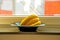 ripe bananas in a black fruit bowl