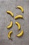 Ripe bananas on gray concrete background. Interior photo. photoArt. top view