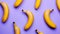 Ripe bananas on a pastel violet background pattern. Top view. Food modern concept. Hard shadow. Generative AI