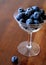 Ripe Blueberries in a Delicate Vintage Champagne Glass
