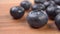 Ripe blueberries on a wooden surface