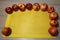 Ripe bright red Florina apples on a yellow napkin