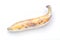 A ripe brown yellow banana is wrapped by preservative plastic film, food protection concept.