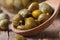 Ripe capers in a wooden spoon macro horizontal