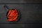 Ripe Cayenne pepper, on black wooden table , top view flat lay, with copy space for text