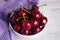 Ripe cherry berries in two white plates, fruit, background