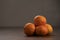 Ripe clementines on walnut wood table