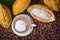 Ripe cocoa pod and beans setup on rustic wooden background