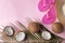 Ripe coconuts, beach hat and flip-flops on color background