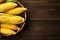 ripe corn in basket country style on the wooden background