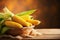 ripe corn in basket country style on the wooden background