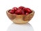 Ripe cornel berries in wood bowl