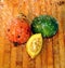 Ripe cut pumpkin and watermelon lie on a wooden board under the drops of water