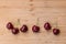 Ripe dark red Stella cherries on bamboo chopping board with copy space above