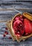 Ripe dissected pomegranate in wooden bowl