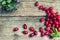 Ripe dogwood on a wooden background. Top view. Close-up