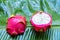 Ripe dragon fruit on a wet green leaf. Vitamins, fruits, healthy foods