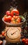 Ripe farm tomatoes on vintage scales, kitchen still life scene.