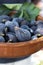 Ripe figs in a rustic earthenware bowl