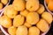 Ripe fresh apricots in plastic bowls. Sale of apricots at the farmers\\\' market