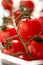 Ripe fresh cherry tomato vine macro close up shot