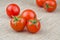 Ripe Fresh Cherry Tomatoes on Coarse Fabric