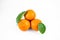 Ripe fresh juicy tangerines with leaves on white background