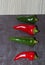 Ripe Fresh large Red and Green Chili`s Slate Background in detail